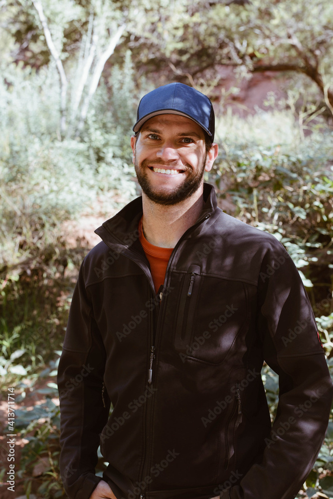 Portrait of confident hiker standing in forest Portrait of confident hiker standing in forest