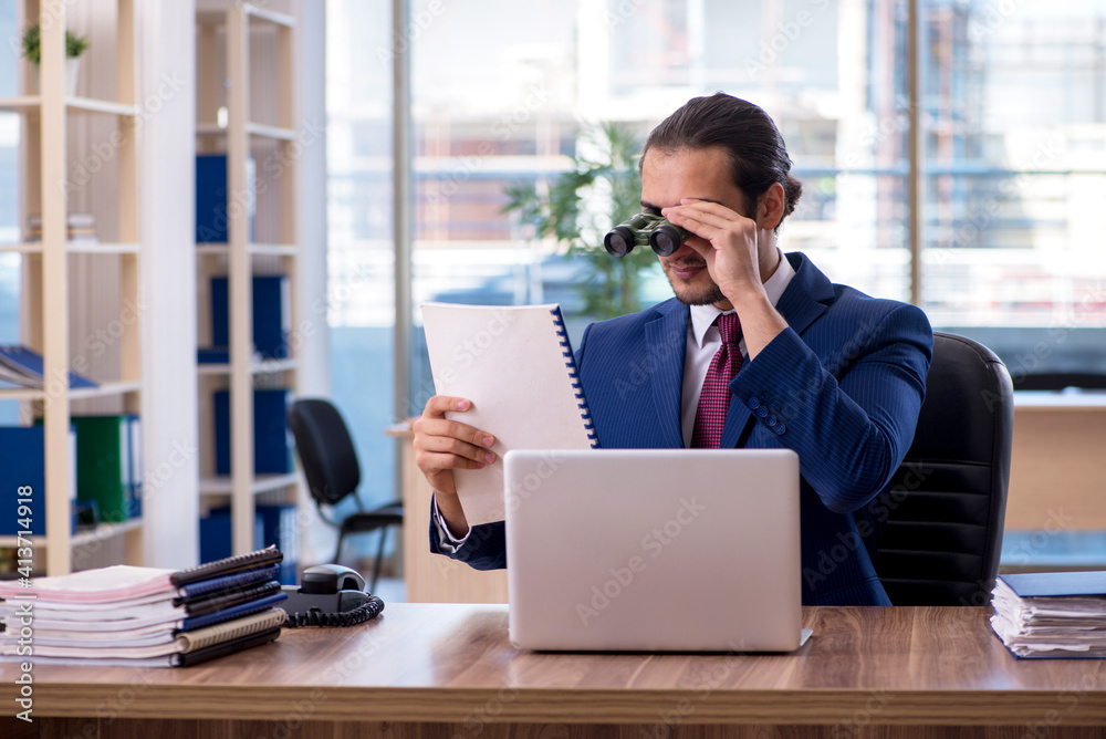 Young businessman employee working in the office Young businessman employee working in the office