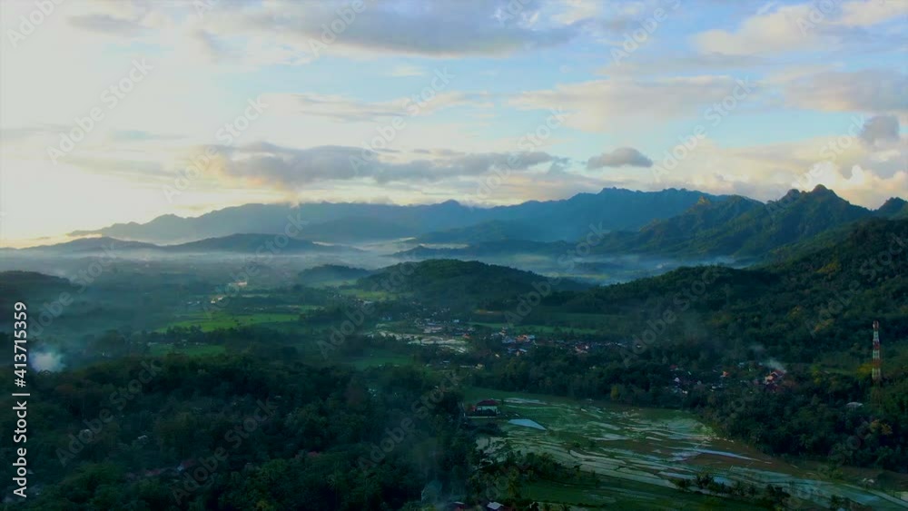 Scenic view of Kajoran village and rice fields at dawn, Java, Indonesia Scenic view of Kajoran village and rice fields at dawn, Java, Indonesia