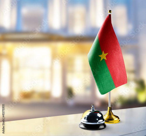 Burkina Faso flag on the reception desk in the lobby of the hotel photo