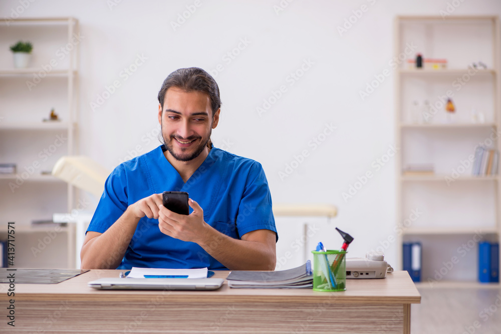 Young male doctor in telemedicine concept Young male doctor in telemedicine concept