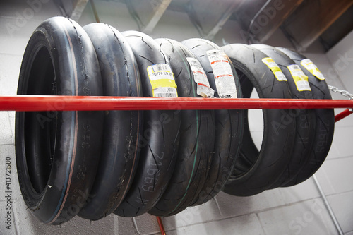 Low angle view of tiers arranged on rack in workshop photo