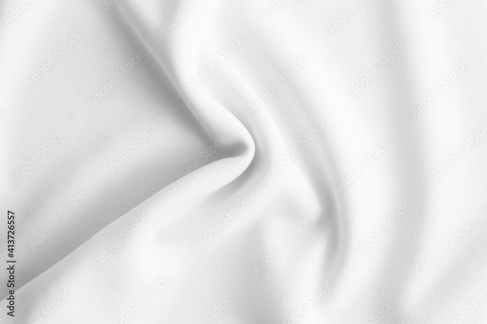 Obraz premium White wavy clothes background. fabric texture
