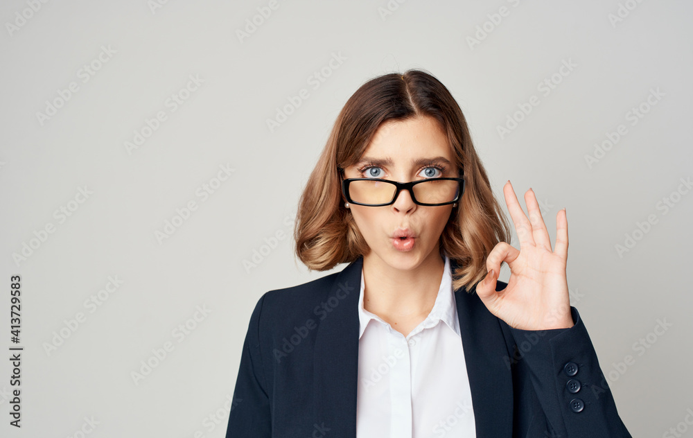 A business woman in a classic suit gestures with her hands Copy Space emotions A business woman in a classic suit gestures with her hands Copy Space emotions