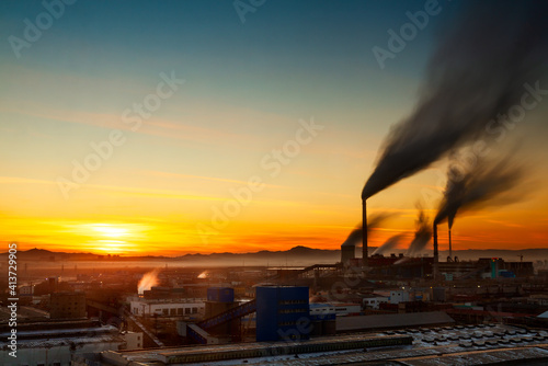 Sunset over a power plant