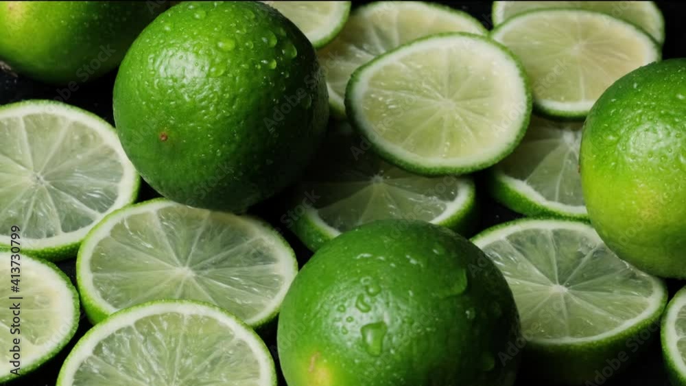 Lime slices closeup, macro background, fruits top view. Rotate. fresh lime for making drinks Lime slices closeup, macro background, fruits top view. Rotate. fresh lime for making drinks