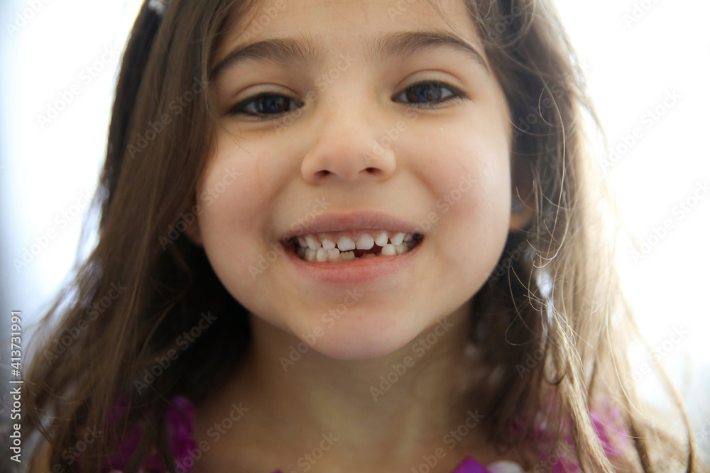 Close-up portrait of girl with gap toothed at home Close-up portrait of girl with gap toothed at home