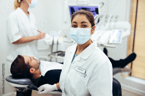 Dentist s assistant with face mask