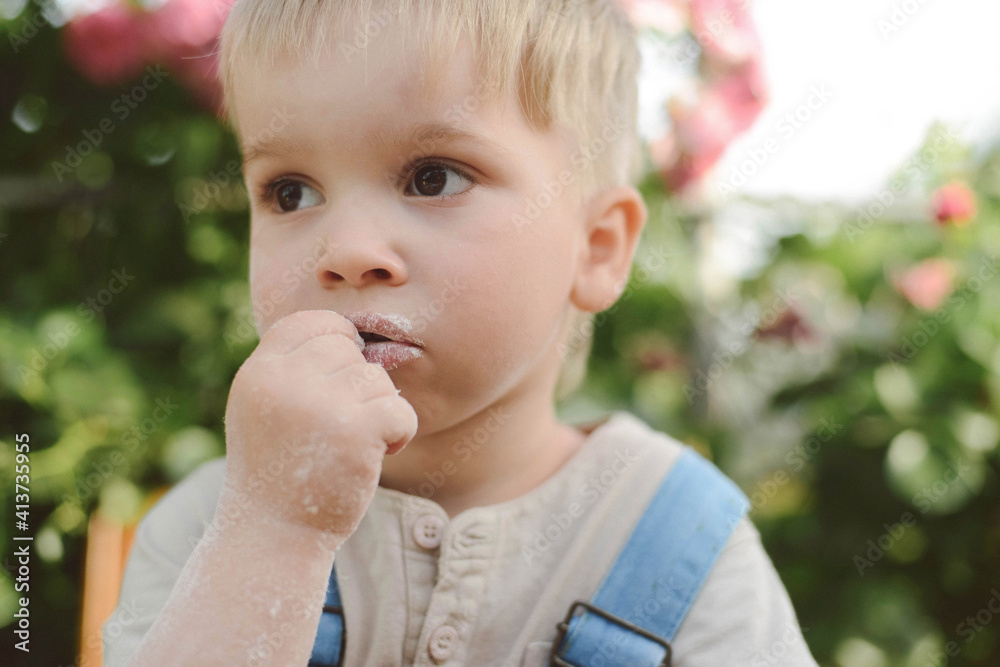 Close-up of thoughtful boy looking away in yard Close-up of thoughtful boy looking away in yard