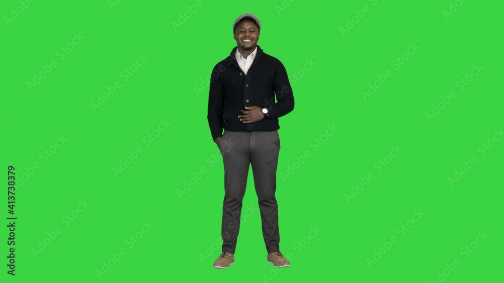 Happy African American businessman smiling on a Green Screen, Chroma Key.