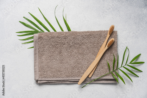 Two bamboo toothbrushes lying on towel. Zero waste lifestyle concept