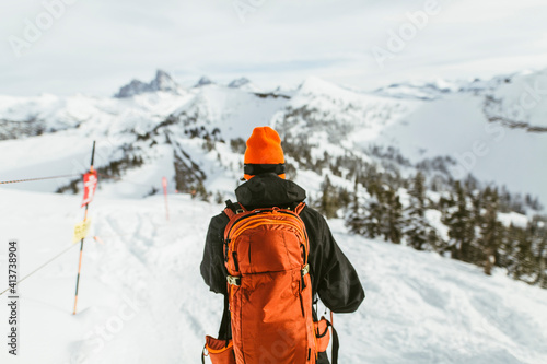 Wallpaper Mural Rear view of hiker with backpack on snowcapped mountain during ski holiday Torontodigital.ca