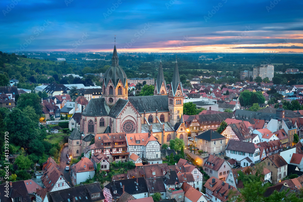 Heppenheim, Germany. Aerial cityscape at dusk with St. Peter church on foreground