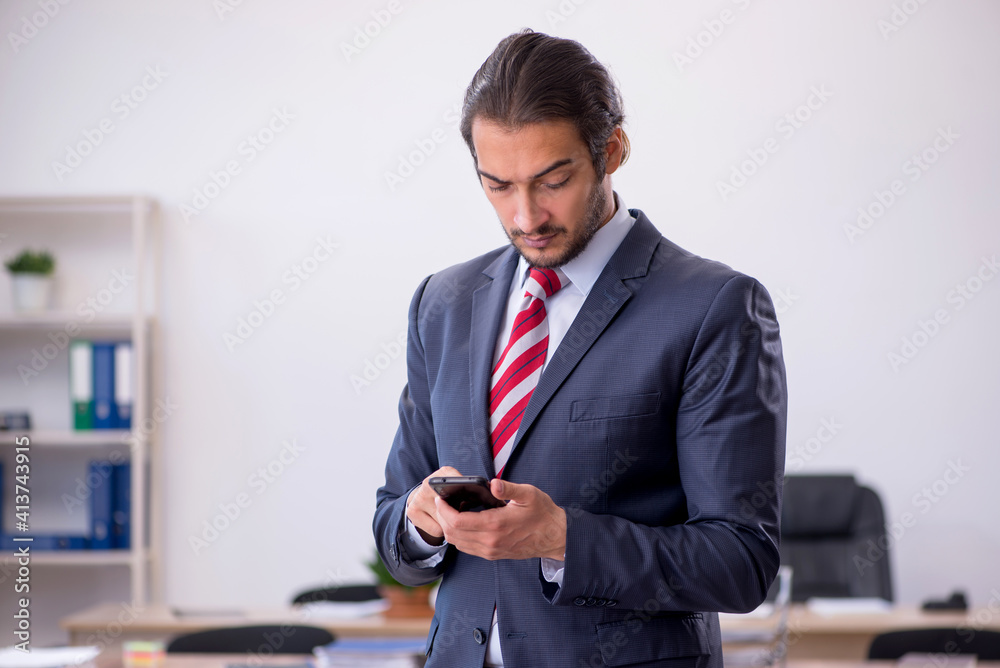 Young man businessman employee sitting in the office Young man businessman employee sitting in the office