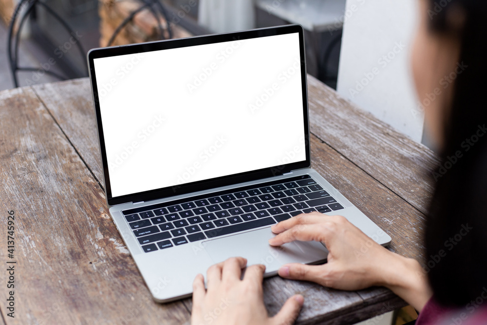 computer screen blank mockup.hand woman work using laptop with white background for advertising,contact business search information on desk at coffee shop.marketing and creative design computer screen blank mockup.hand woman work using laptop with white background for advertising,contact business search information on desk at coffee shop.marketing and creative design