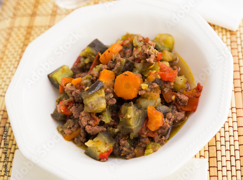 dish of vegetable stew. stewed eggplant, minced meat, carrots, peppers, onion squid