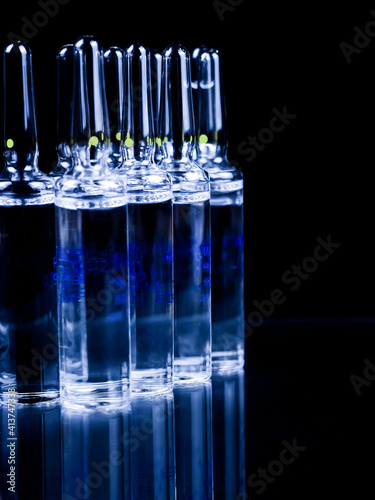 Ampoules on a black background.