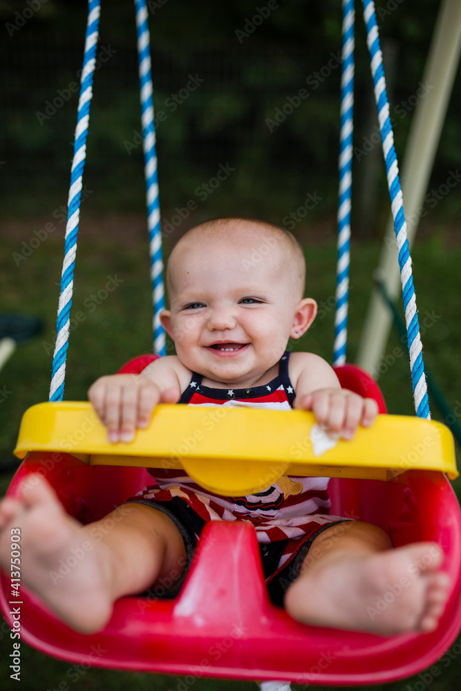 Portrait of baby girl swinging at playground Portrait of baby girl swinging at playground