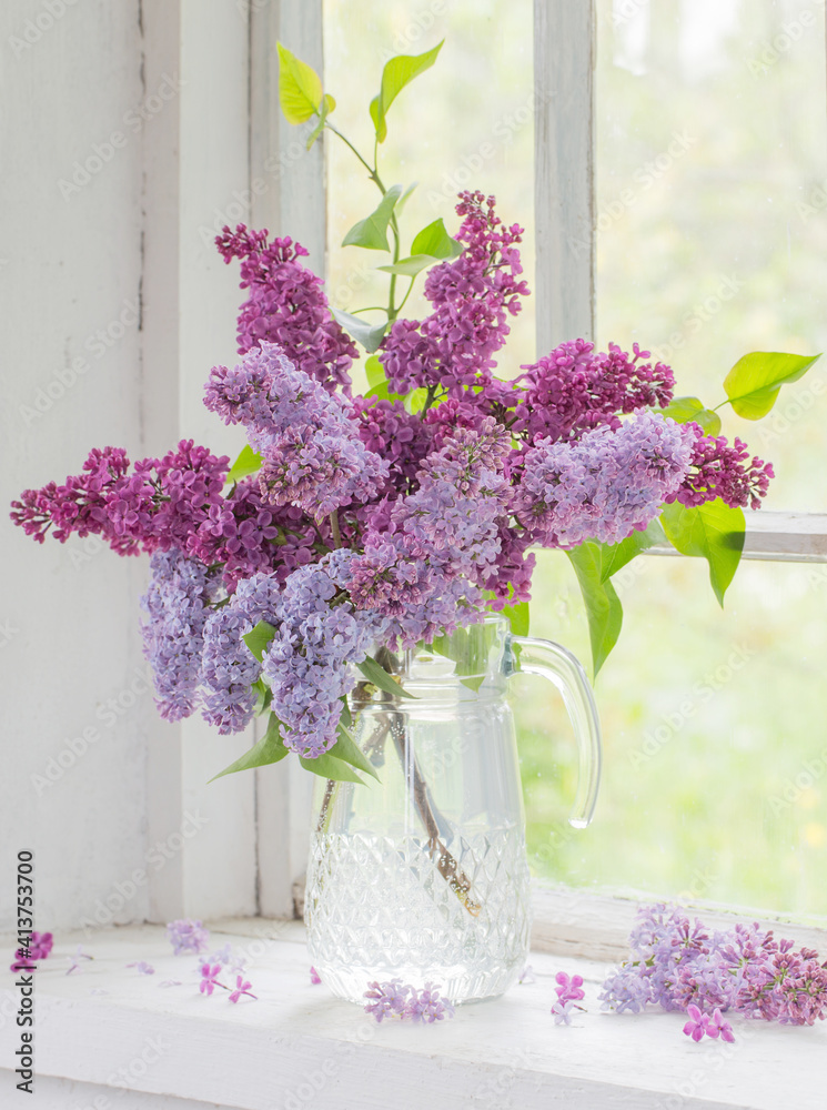 bouquet of lilacs in a glass jug