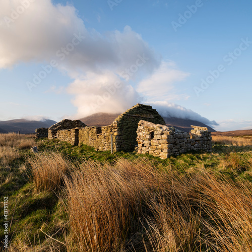 Derelict stone croft house at Rackwick Bay, Hoy, Orkney, Scotland photo