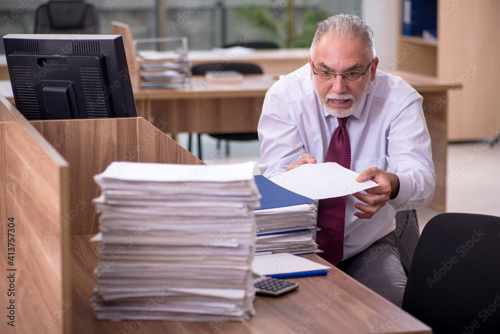 Old businessman employee and too much work in the office