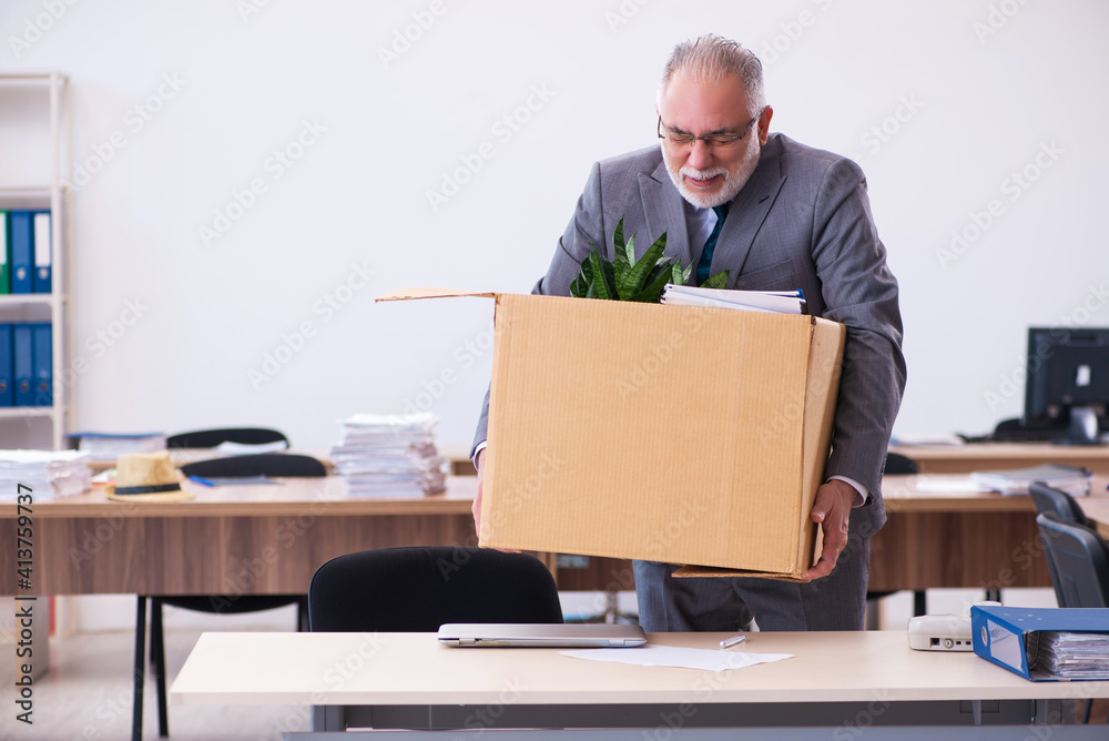 Old male employee being fired from his work Old male employee being fired from his work