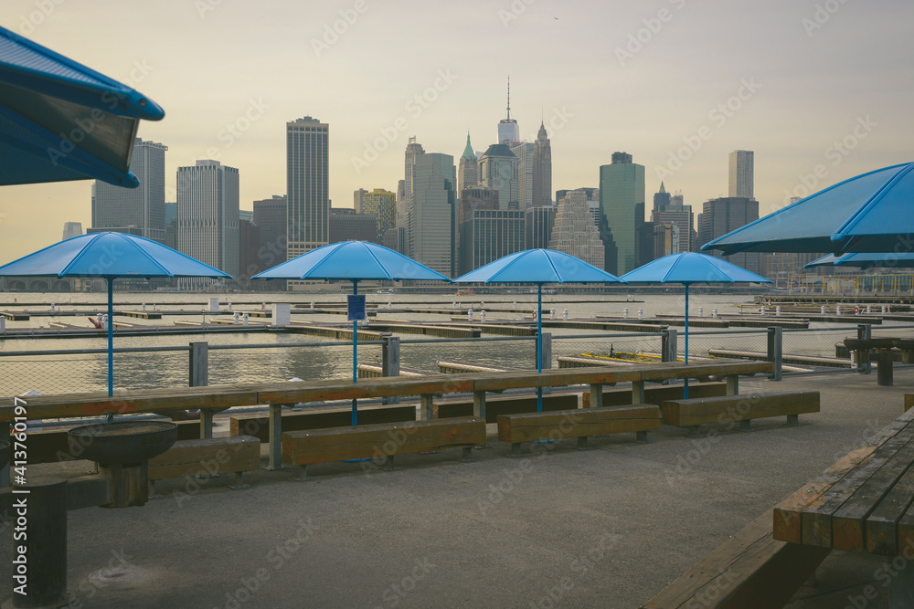 Parasols on promenade against city skyline Parasols on promenade against city skyline