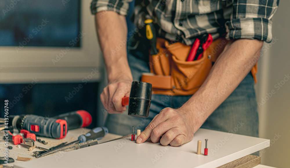 Man working during process of furniture manufacturing