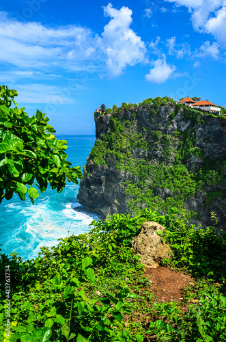 The view of the Uluwatu temple in Bali in Indonesia. High cliff and the sea.