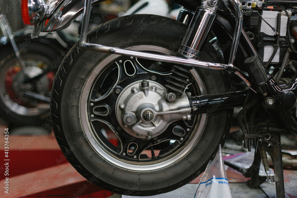 Close-up of motorcycle tire in auto repair shop Close-up of motorcycle tire in auto repair shop