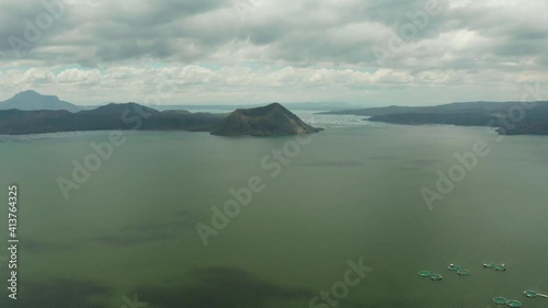 Taal volcano on an island in middle lake, aerial view. Luzon, Philippines Tropical landscape, mountains and volcano in the lake. photo