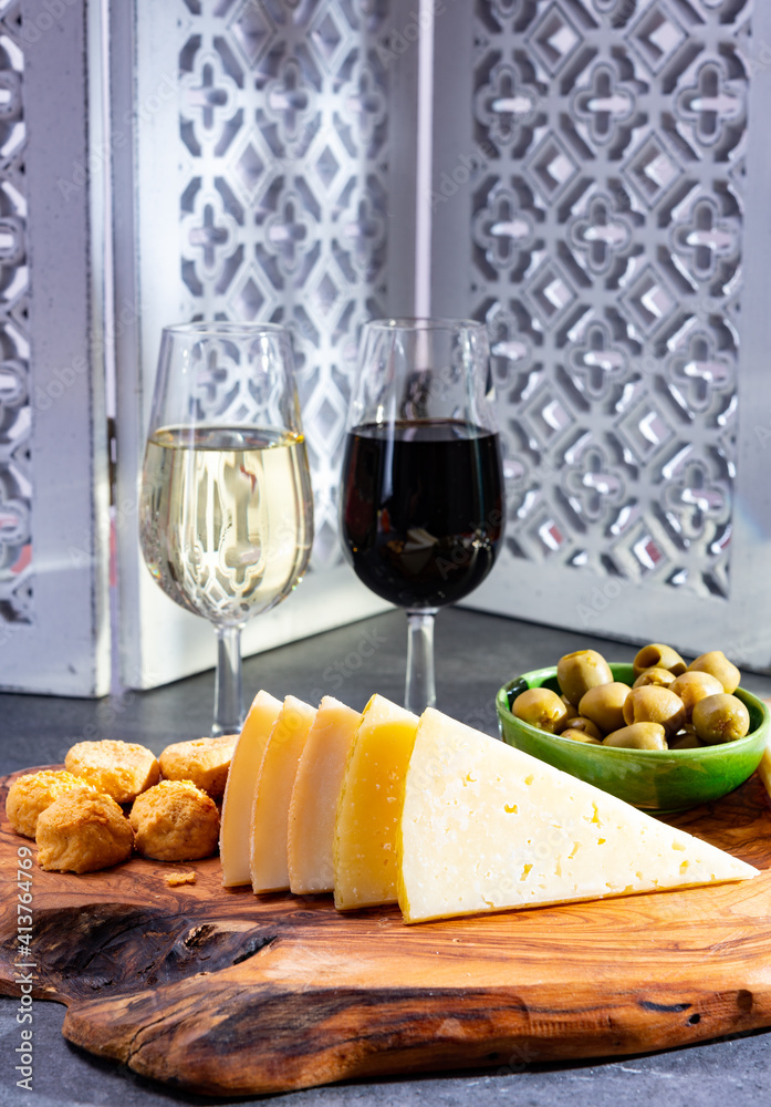 Tasting of fortified Andalusian dry and sweet sherry wine with traditional Spanisch tapas, green olives, goat and sheep manchego cheese Tasting of fortified Andalusian dry and sweet sherry wine with traditional Spanisch tapas, green olives, goat and sheep manchego cheese