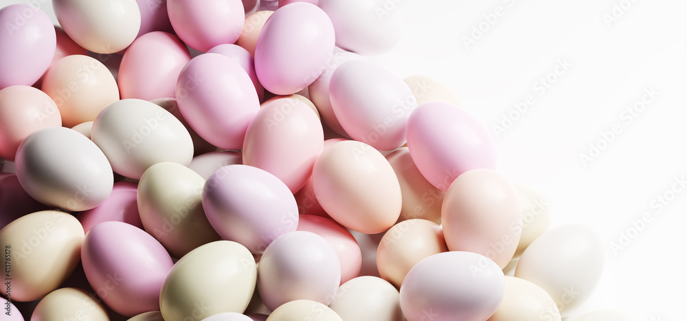 Easter eggs painted in pastel colors background