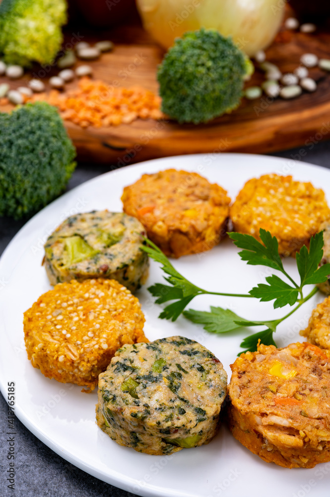 Small tasty vegan and vegetarian burgers made from fresh vegetables and dried legumes and beans Small tasty vegan and vegetarian burgers made from fresh vegetables and dried legumes and beans