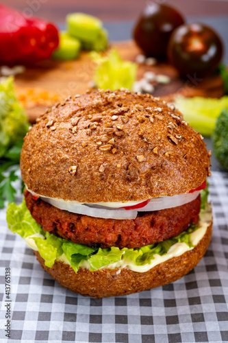 Tasty hamburger made with vegetarian plant based imitation minced meat burger and fresh vegetables