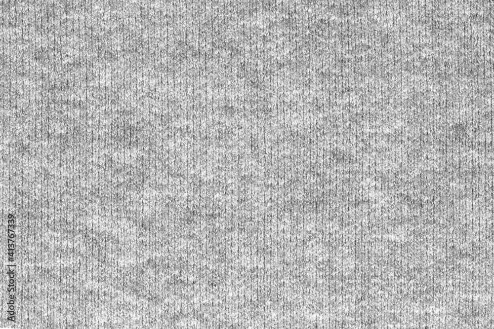Gray natural texture of knitted wool textile material background. grey crochet cotton fabric woven canvas texture. close up Gray natural texture of knitted wool textile material background. grey crochet cotton fabric woven canvas texture. close up