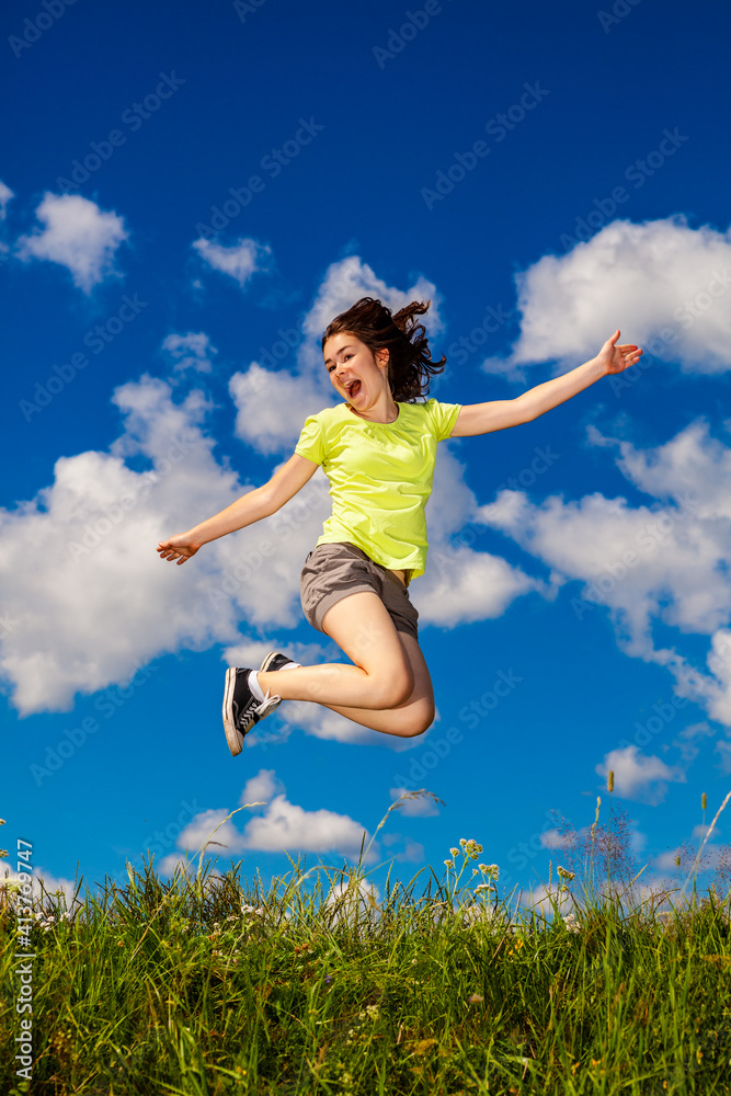 Girl jumping, running against cloudy sky
Girl jumping, running against cloudy sky