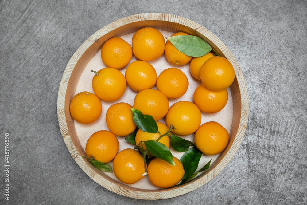 Overhead view of mandarin oranges in wooden container Overhead view of mandarin oranges in wooden container