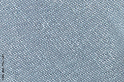 light blue dense fabric with a relief, background, texture