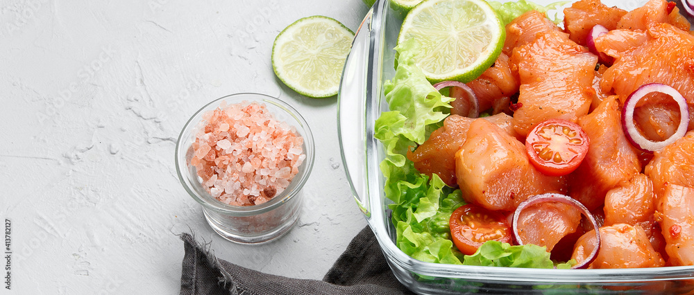 Raw and marinated chicken fillet on light background. Dietary meat. - obrazy, fototapety, plakaty 