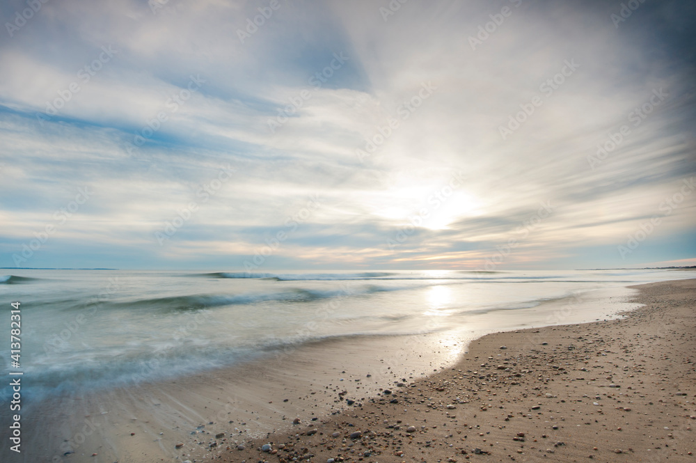 Scenic view of beach against cloudy sky Scenic view of beach against cloudy sky