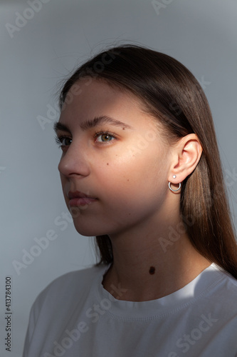 Beautiful jewelry model in modern silver round minimal earrings