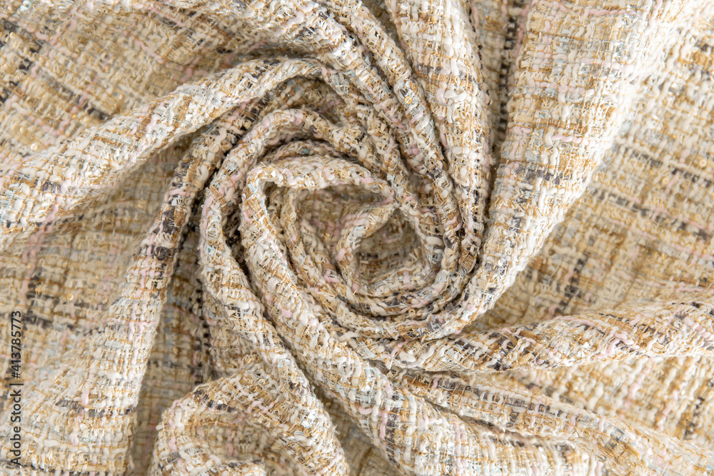 Fototapeta premium light yellow dense fabric with a spiral drapery