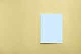 White invitation card mockup on a yellow background