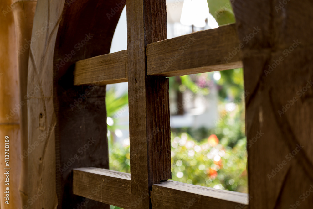 Old wooden doors at the beautiful tropical garden Old wooden doors at the beautiful tropical garden