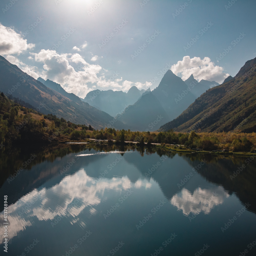 Caucasus, Dombay, a mountain lake tumanly-Kel with reflection of the mountains in Sunny weather