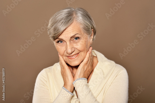 Portrait of happy senior woman at home