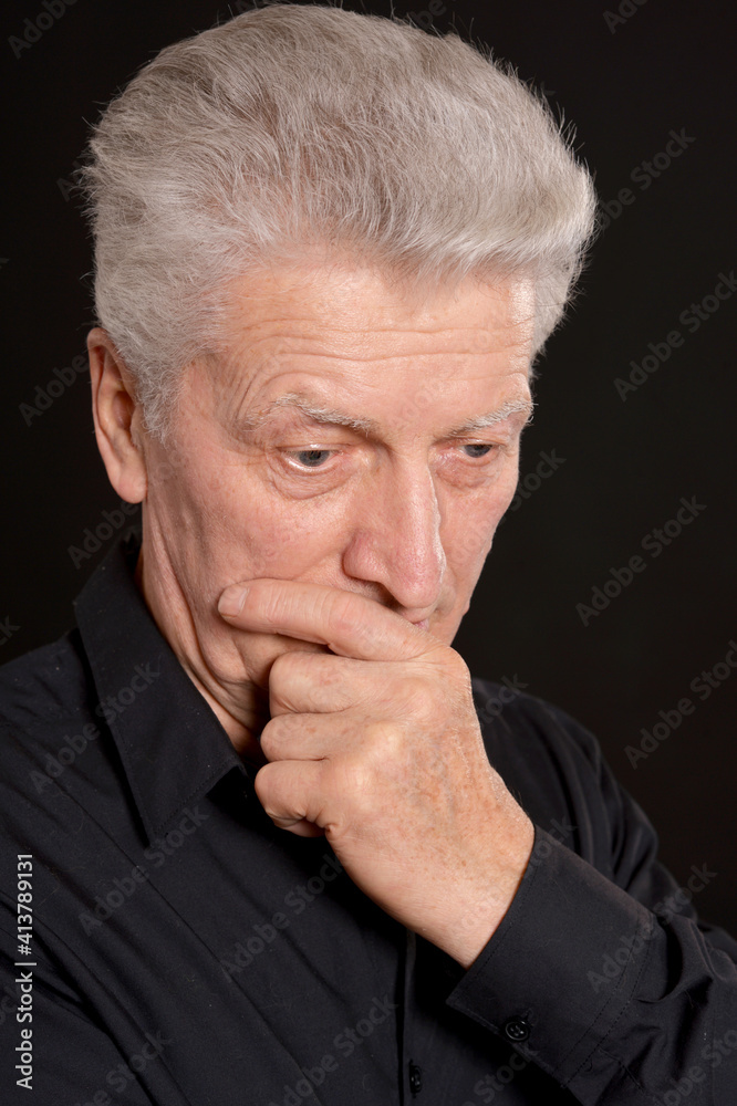 portrait of sad senior man in studio portrait of sad senior man in studio