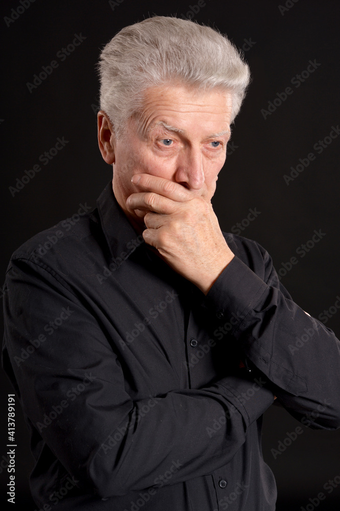 portrait of sad senior man in studio portrait of sad senior man in studio