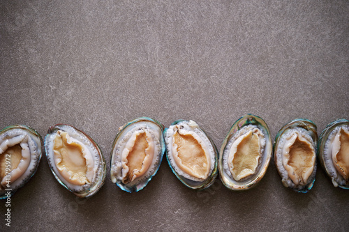 Raw abalone washed clean on marble 
